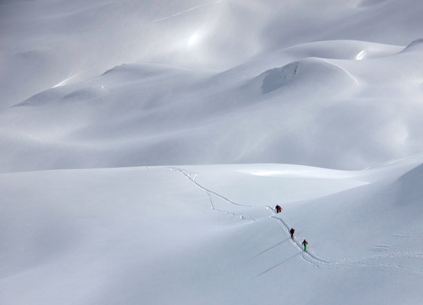 Ski touring with a guide.